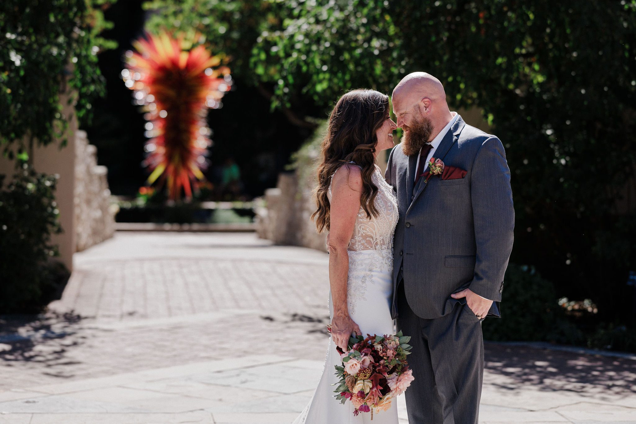man and woman pose for photographer after choosing the best place to propose in colorado