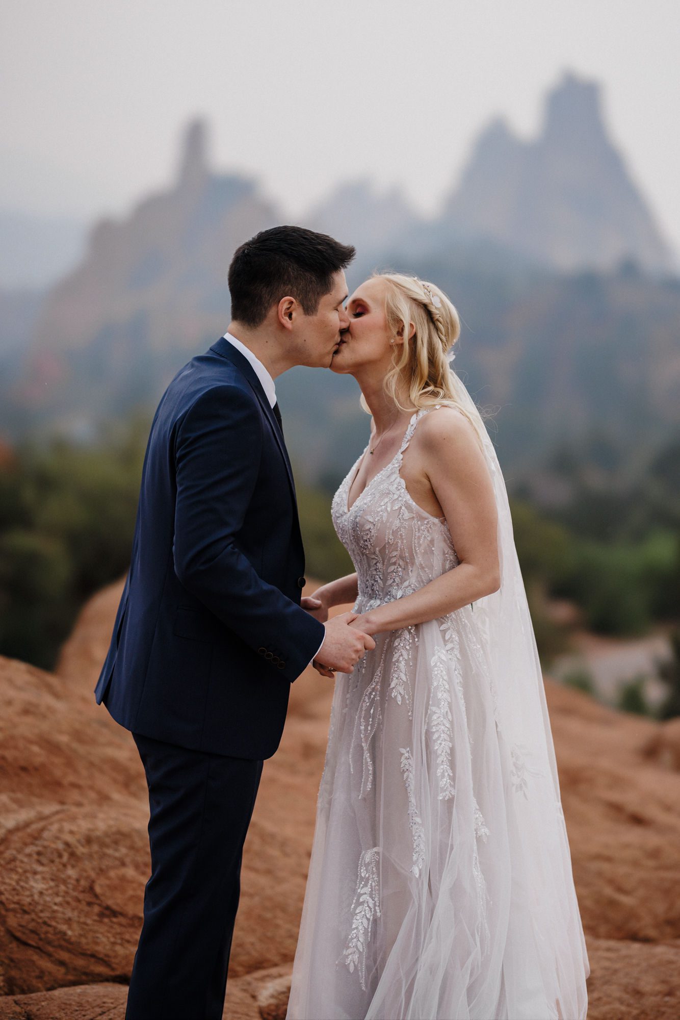 bride and groom take photos at romatic colorado proposal location