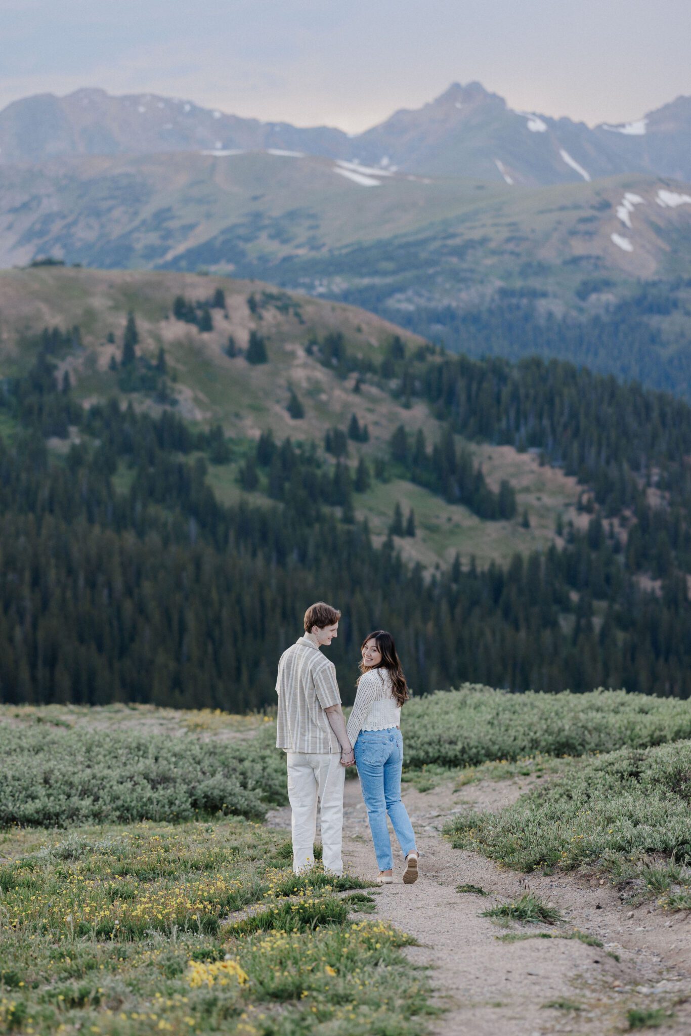 best place to propose in colorado: engaged couple walks along trail in breckenridge during photos
