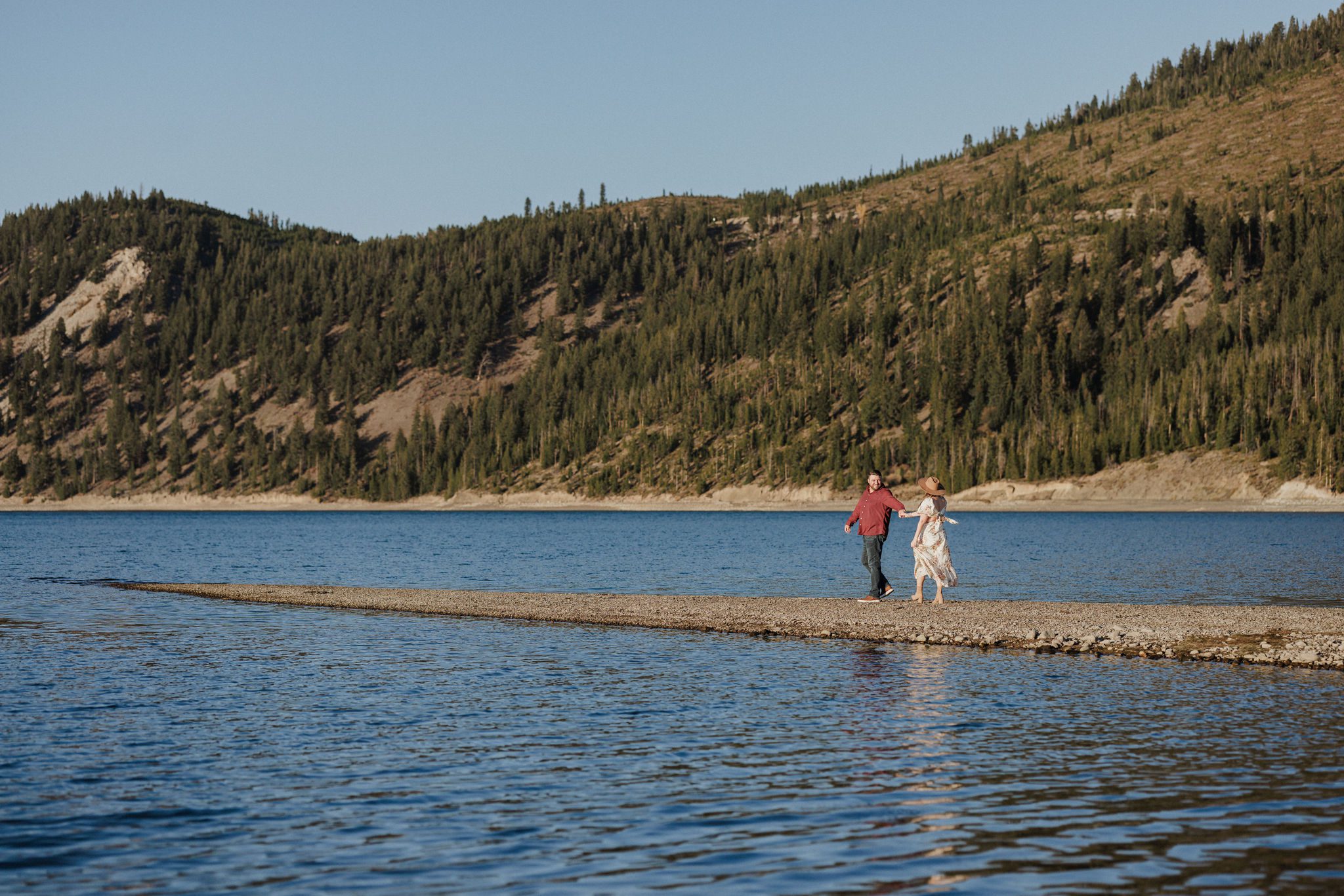 best place to propose in colorado engaged couple walks along lake dillon during photos