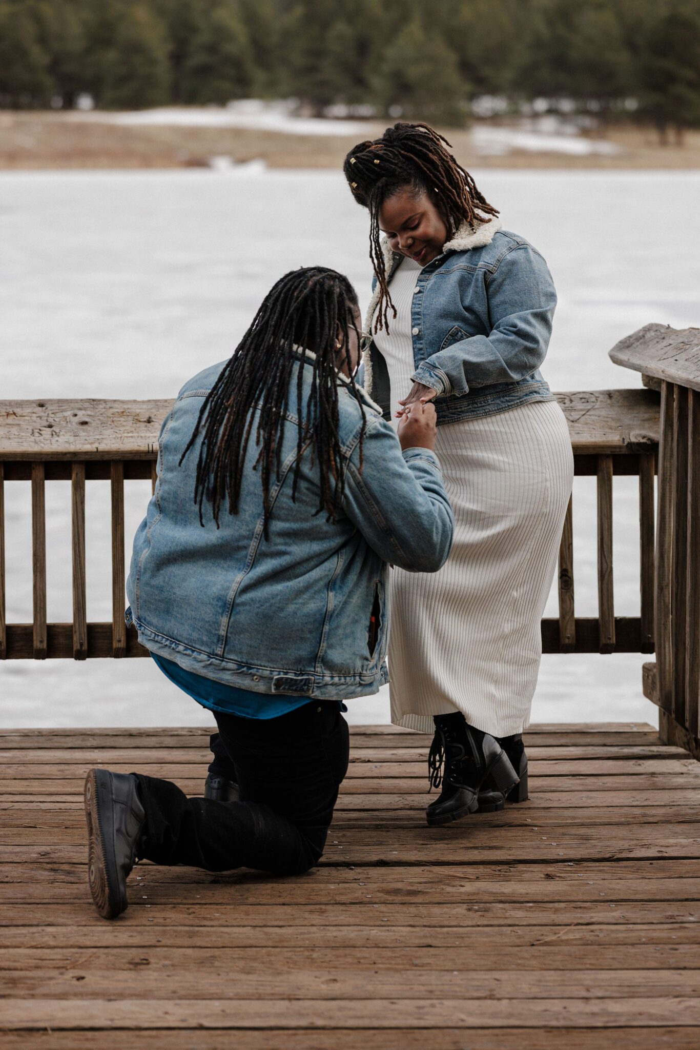 person gets down on one knee to propose to their partner in colorado
