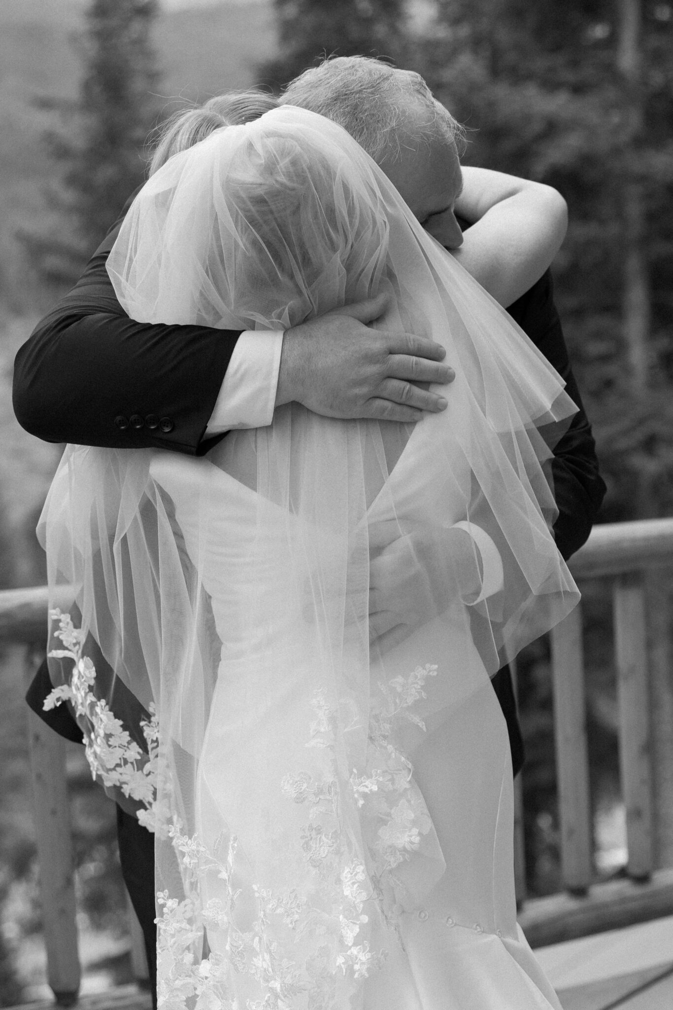 bride and her father give each other a big hug before the airbnb wedding ceremony