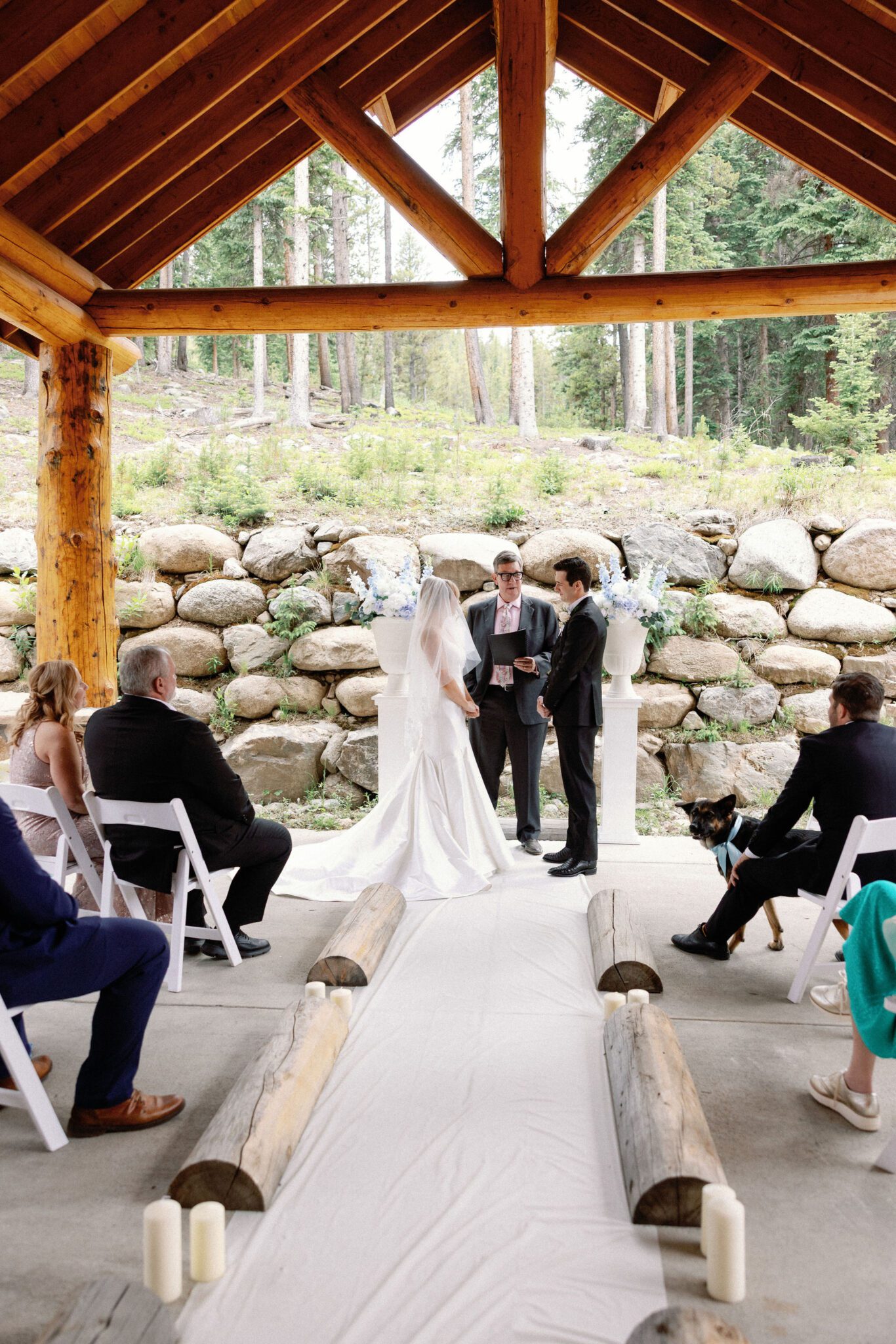 bride and groom stand at the front of the wedding ceremony that was hosted at the airbnb