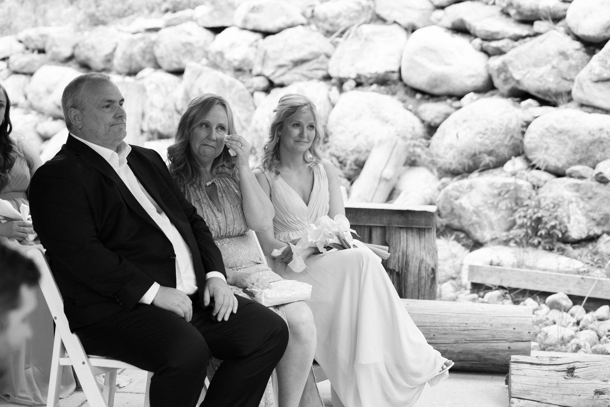 brides family tears up as they watch the wedding ceremony