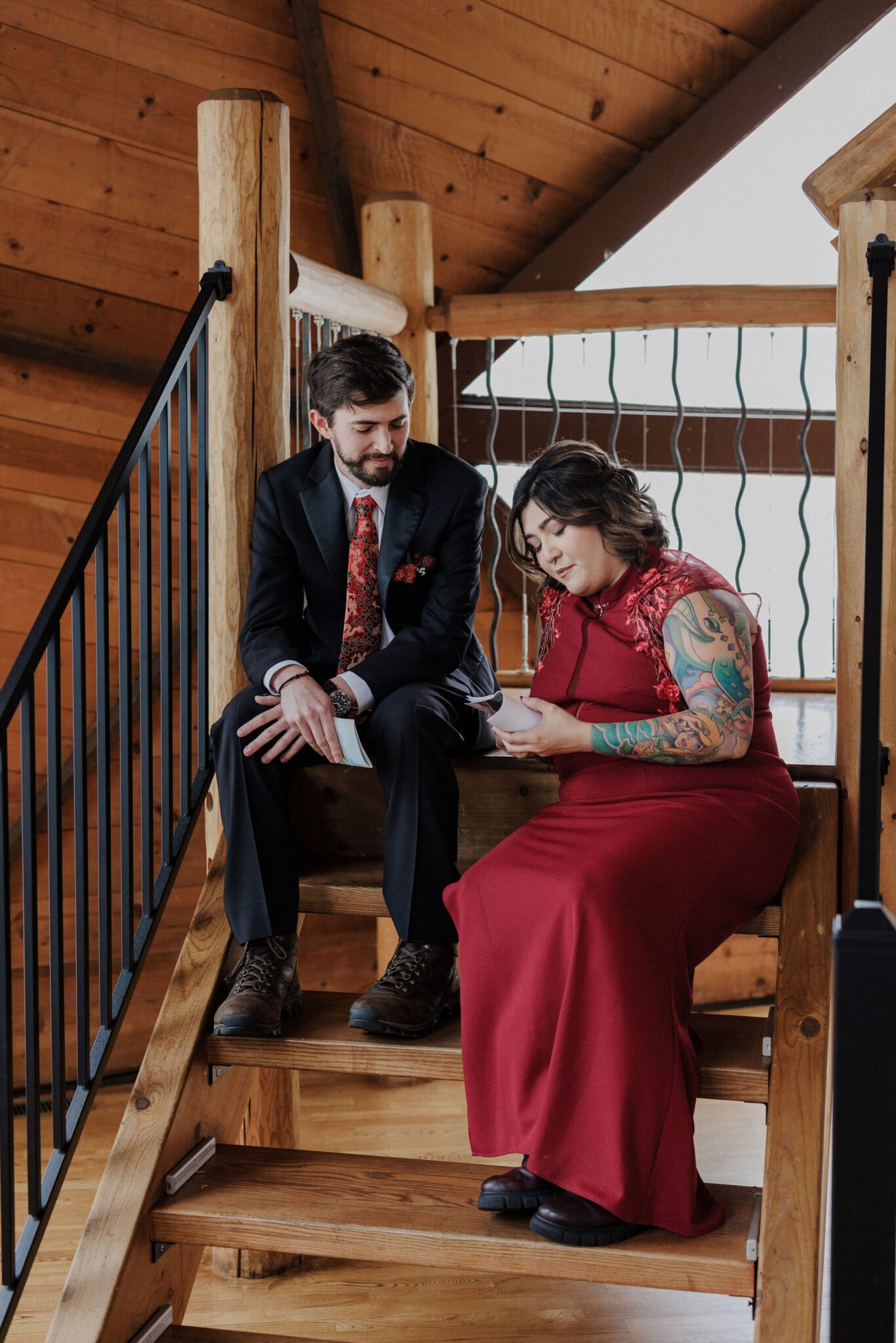 bride and groom sit on the steps of their airbnb and say wedding vows